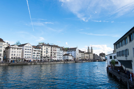 May 13, 2017 - Zurich, Switzerland: View of Limmat river and building along riverbank. Twin tower is Wasserkirche or Water church of Zurich.のeditorial素材