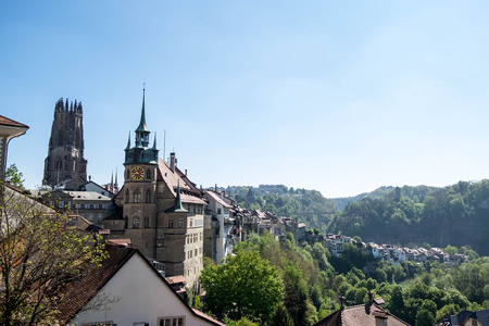 May 10, 2017 - Fribourg, Switzerland: Cityscape of Fribourg town with City Hall and The Gothic cathedral of St. Nicholas tower.のeditorial素材