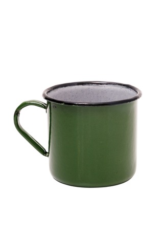Old green tin Cup on white background. Green vintage metal mug isolated on white background.の写真素材