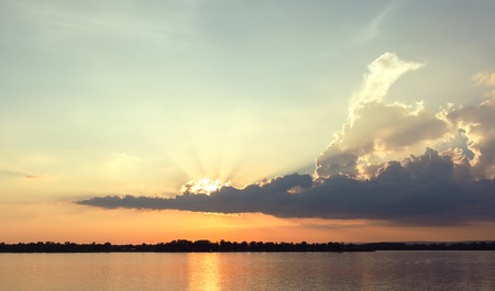 Beautiful sunset with amazing cloud at river