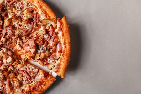 Hot cheese pizza on grey background, top view. Space for text. The concept of pizza menu.の写真素材