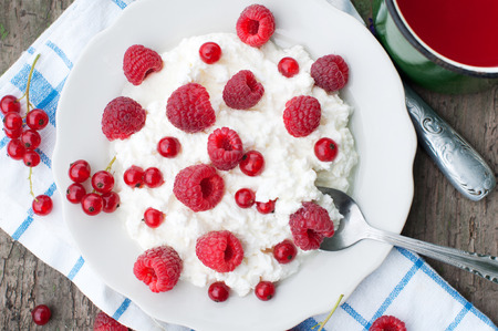 Cottage cheese with raspberry and currant. Dessert with berriesの写真素材