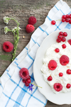 Cottage cheese with raspberry and currant. Dessert with berriesの写真素材