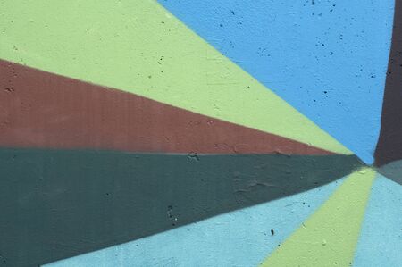 Fragment of graffiti on the wall with geometric backgroundの写真素材
