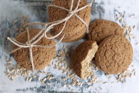 Oat cookies with oat grains on a white background. Top viewの写真素材
