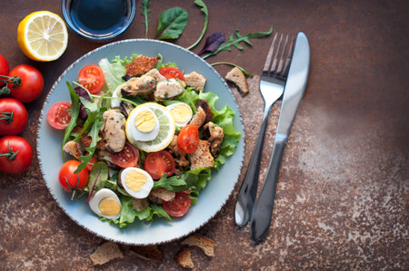 Salad with mussels, tomatoes, eggs, arugula, spinach, lemon and croutons on dark brown background. Seafood salad with vine sauce. Top viewの写真素材