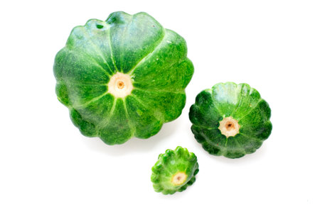 Three vegetable squash on green backgroundの写真素材