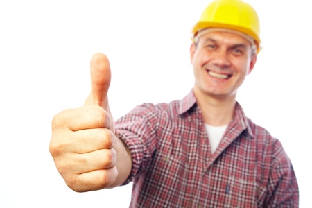handsome man builder smiles and shows a gesture OKの写真素材