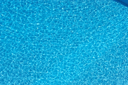 Close-up of transparent azure swimming pool with clean waterの写真素材