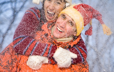 The young family plays winter wood on snow in Valentineの写真素材