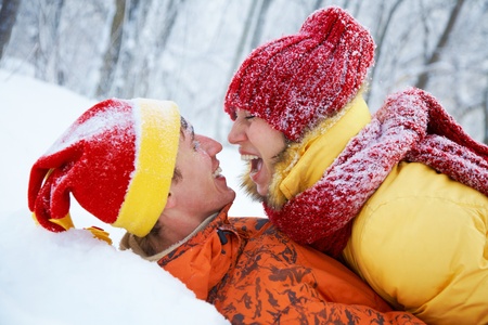 The young pair kisses in the winter Valentineの写真素材