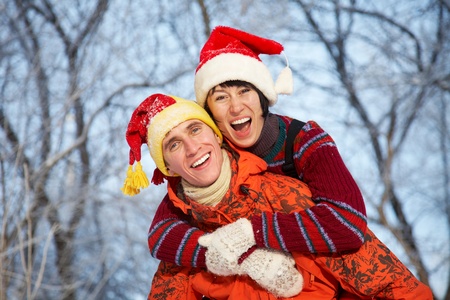 young family plays winter wood on snowの写真素材