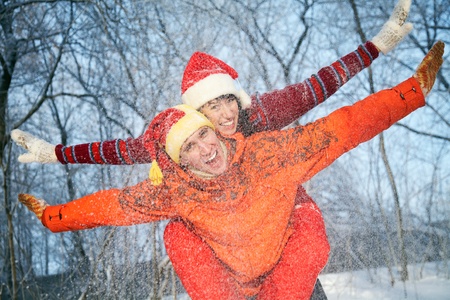 The young family plays winter wood on snow in Valentineの写真素材