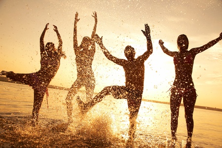strong man jumps on the jetski above the water at sunset .silluet. spray.の写真素材