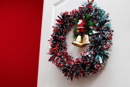 Christmas  garland  jn the white doorの写真素材