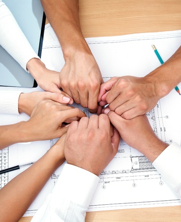 picture of hands to stay together over the table to show solidarity teamの写真素材