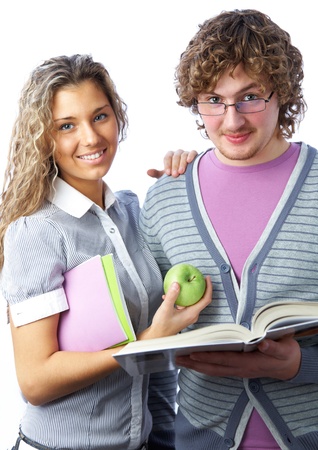 students: boy and  girl with notebooks and books smiling on white backgroundの写真素材