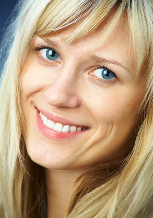 portrait of a beautiful young woman with curly hairの写真素材
