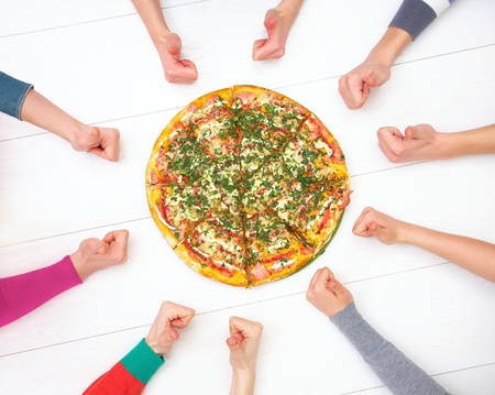 hot delicious pizza and human hands with thumbs up sign aroundの写真素材