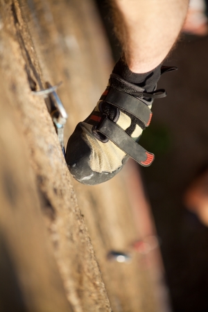 Rock climber's foot on rockの写真素材