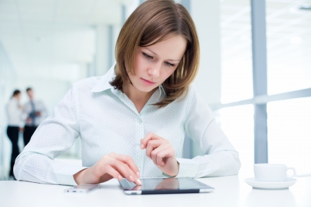 Young businesswoman holding a digital tabletの写真素材