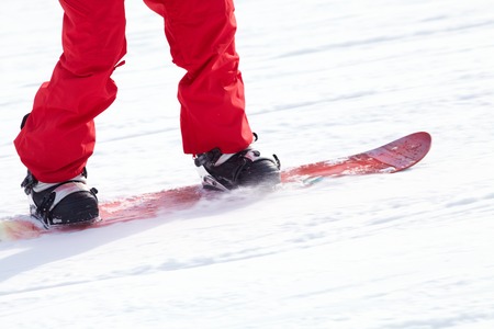 unrecognizable snowboarder on ski resortの写真素材