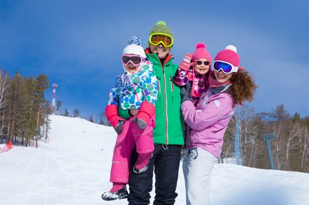 happy family in winter clothing at the ski resortの写真素材