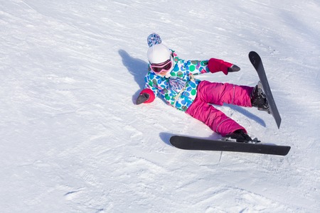 little girl learning to ski at the ski resortの写真素材