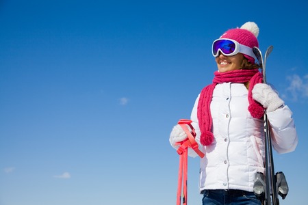 portrait of young smilling woman  on winter holiday outdoorの写真素材