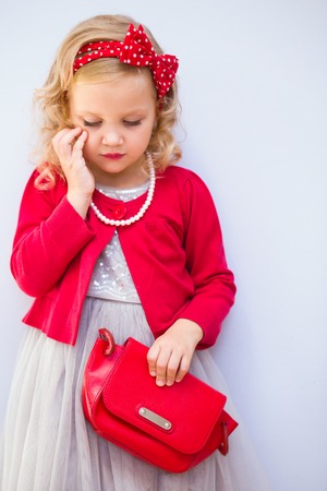 portrait of a little cute girl fashionistaの写真素材