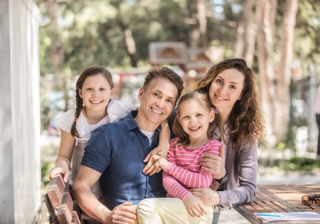 family lifestyle portrait of a mum and dad with their children having good timeの写真素材