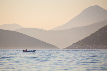 beautiful view of the mountainous coast in a calm seaの写真素材