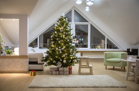 Festively decorated home interior with Christmas treeの写真素材