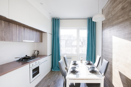 Kitchen interior with window in modern apartmentの写真素材