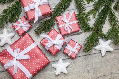 beautiful Christmas picture with branches of a Christmas tree, gifts and New Year's ornamentsの写真素材