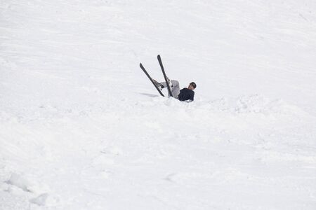 young man learning to ski at the ski resortの写真素材