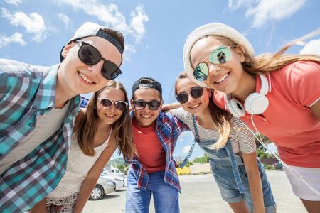 funny portrait of group of teenagers spending time togetherの写真素材