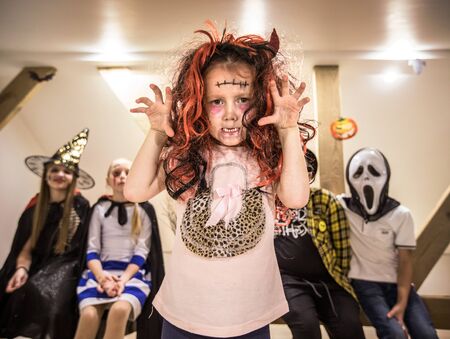 little girl in costumes of witch  for Halloween celebrationの写真素材