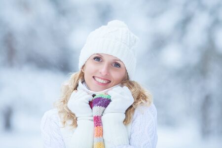 Portrait of blond young woman in winterの写真素材