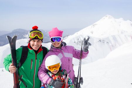 happy family in alpin ski equipment  at the ski resortの写真素材