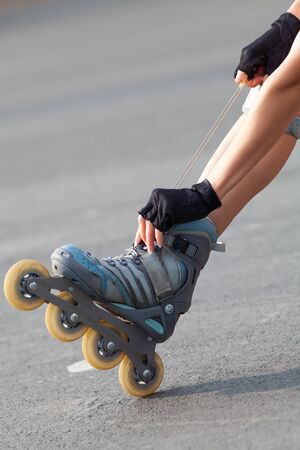 Close-up Of Legs Wearing Roller Skating Shoe, Outdoorsの写真素材