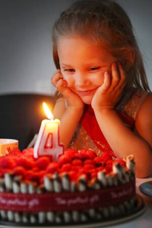 Portrait of cute little girl with birthdays cakeの写真素材