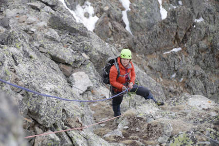 mountaineer woman climbing to the mountainの写真素材