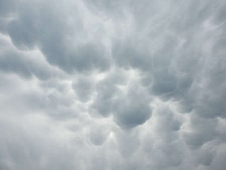 thick gray clouds in an unusual celestial phenomenonの写真素材