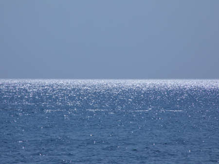 Beautiful seascape at noon. Gdad water with a shining horizon line.の写真素材