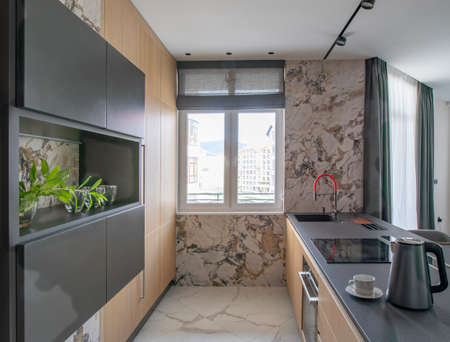kitchen interior with window in modern apartmentの写真素材