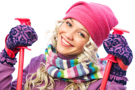 Portrait of beautiful girl in winter sportswear with ski equipmentの写真素材