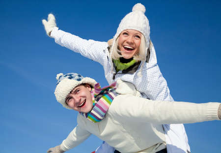 Attractive young couple having fun winter timeの写真素材