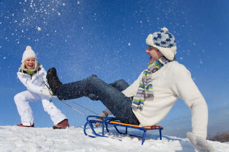 young couple having fun winter time in ski resort