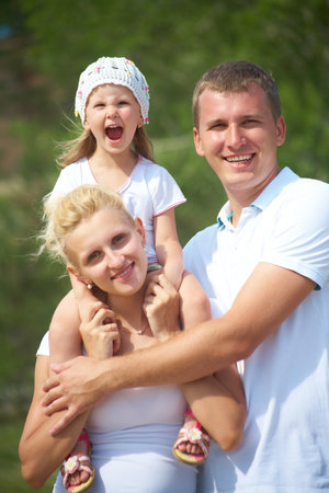 Portrait of young couple with their little daughterの写真素材